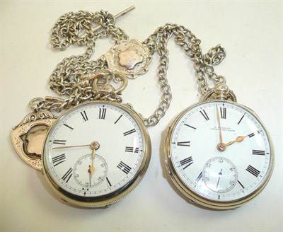 Lot 107 - Two silver open faced pocket watches, silver watch chain and white metal chain and two attached...