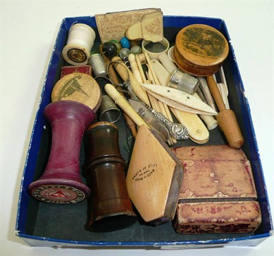 Lot 129 - Collection of Mauchlineware pin cushions and sewing implements