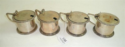 Lot 134 - Set of four silver mustard pots, circa 1930