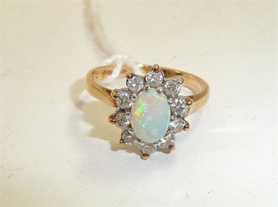 Lot 142 - A 9ct gold opal and diamond cluster ring