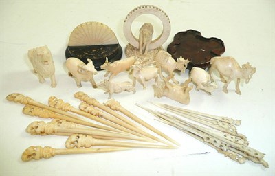 Lot 147 - Two sets of ivory tooth picks and animals