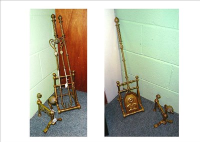 Lot 169 - Brass Aesthetic Movement companion set comprising a pair of fire dogs, three fire implements...