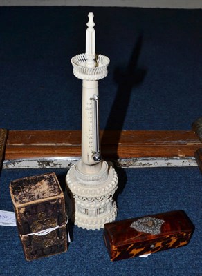 Lot 207 - A Turned and Pierced Ivory Table Thermometer, mid 19th century, the form of a tower with spiral...