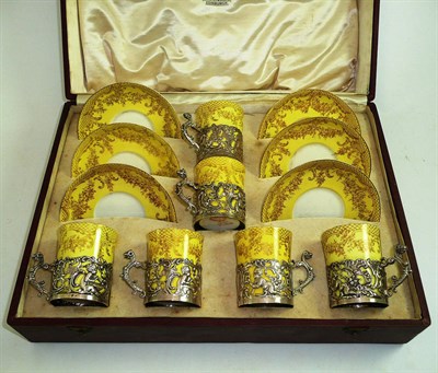 Lot 217 - Cased Crown Staffordshire silver mounted yellow ground coffee set