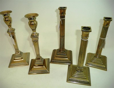 Lot 218 - Two pairs of Paktong candlesticks and a single