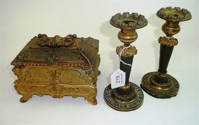 Lot 219 - An ormolu casket and a pair of bronze and brass candlesticks