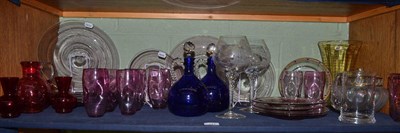 Lot 241 - Coloured glass comprising a pair of late Victorian blue flagons with stoppers, cranberry jug,...