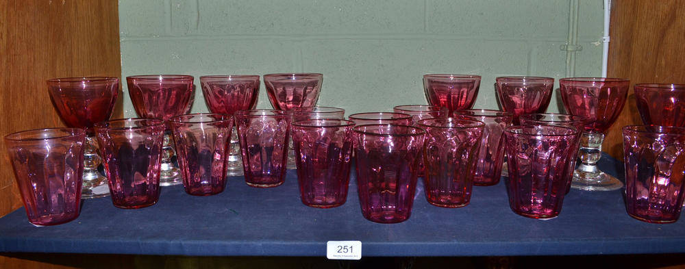 Lot 251 - A set of eight Asprey cranberry glass rummers and fourteen similar beakers