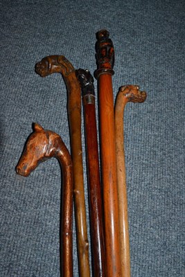 Lot 259 - Five walking sticks with novelty carved handles