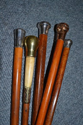 Lot 267 - Two Malacca walking sticks and three others (three with silver pommels)