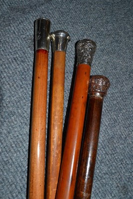 Lot 268 - A Malacca walking cane with silver pommel and three others (two with silver pommels)