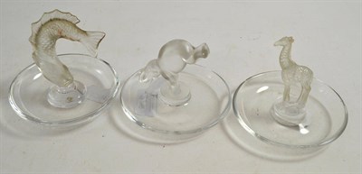 Lot 276 - Three Lalique glass ashtrays as an elephant, fish and giraffe