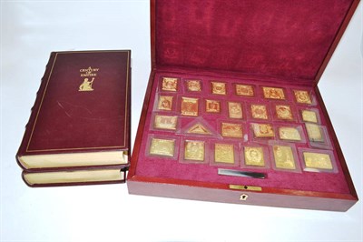 Lot 299 - Cased set silver gilt stamp/ingots with books