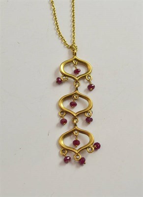 Lot 310 - An 18ct gold ruby chandelier pendant on a chain