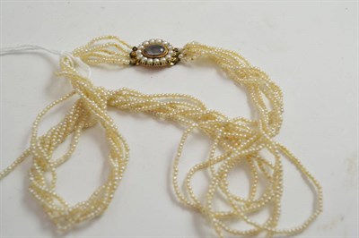 Lot 312 - A seed pearl necklace with mourning clasp (a.f.)