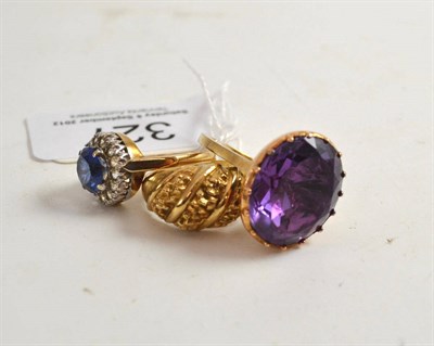 Lot 327 - A 9ct gold blue and white synthetic spinel cluster ring, an oval foil backed amethyst ring and...