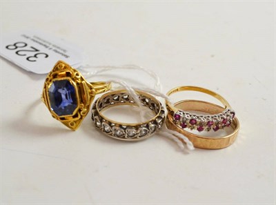 Lot 328 - A 9ct gold band ring, a 9ct gold ruby and diamond ring, an eternity ring and a synthetic...