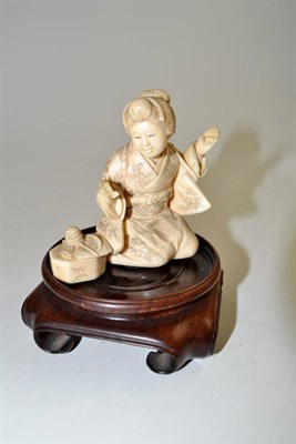 Lot 329 - Japanese ivory figure of a girl seated