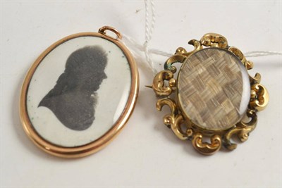 Lot 340 - A mourning brooch and pendant with silhouette and hair enclosed