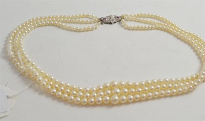 Lot 362 - A three strand pearl necklace