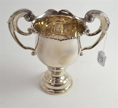 Lot 371 - A George V silver twin handled trophy cup, Sheffield, 1924