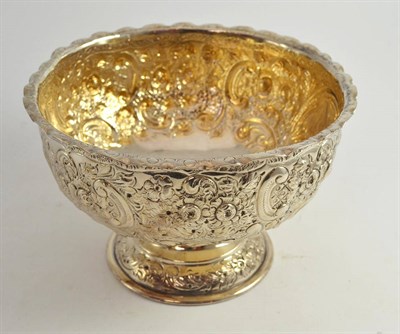 Lot 373 - A Victorian silver pedestal bowl with repousse decoration, JW over FCW, London 1899