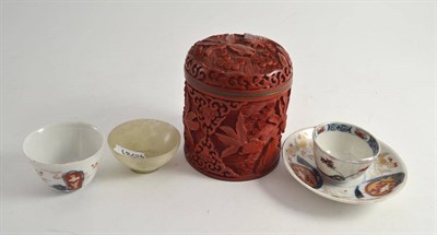 Lot 391 - A cinnabar lacquered jar and cover; two tea bowls; a saucer and a small jade bowl