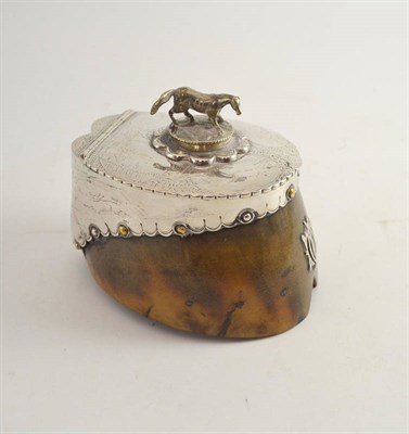 Lot 394 - A horse hoof with plated mounts