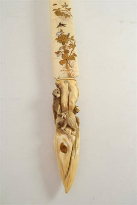 Lot 398 - A good Japanese carved ivory page turner carved with rats and shibyana style inlay