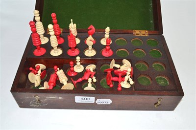 Lot 400 - A natural and stained ivory chess set