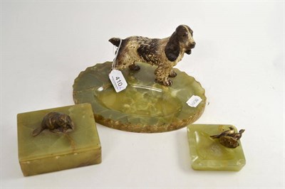 Lot 410 - A large green onyx ashtray with a cold painted bronze spaniel, a smaller ashtray and trinket box