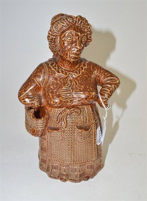 Lot 438 - A saltglaze tobacco jar and cover, as a woman, perhaps Scottish