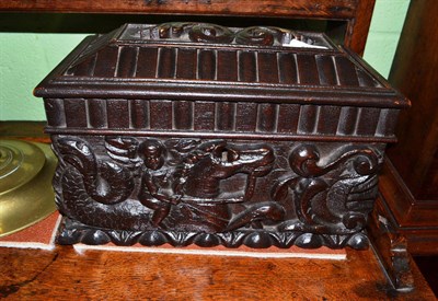 Lot 462 - A Victorian oak caddy made from earlier panelling