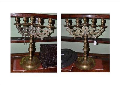 Lot 463 - A pair of 19th century brass Polish five branch candlesticks