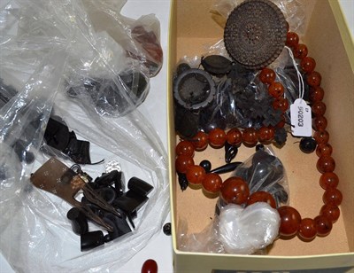 Lot 480 - A box of assorted jet and bog oak items, mainly unstrung and a bead necklace