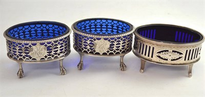 Lot 489 - A pair of late 18th century silver salts with pieced side, blue glass liners, ball and claw...