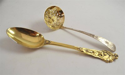 Lot 493 - A Victorian silver gilt spoon, GA, London 1865, decorated in relief with classical figures; and...