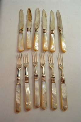 Lot 498 - A set of six silver bladed fruit knives and forks with mother of pearl handles, Sheffield, 1919