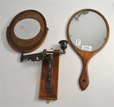 Lot 519 - A shaving mirror on bracket and a mahogany hand mirror