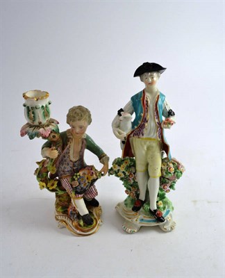 Lot 521 - 18th century porcelain flower encrusted figure and an 18th century china figurine of a shepherd