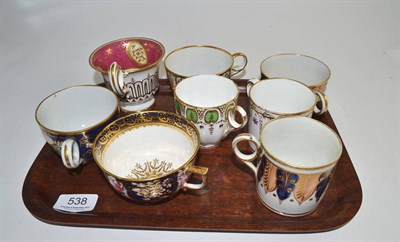 Lot 538 - Eight English porcelain gilt and floral decorated cabinet cups