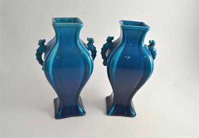 Lot 542 - A pair of turquoise glazed vases in the Chinese style