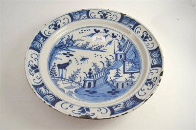 Lot 545 - A blue and white Delft charger