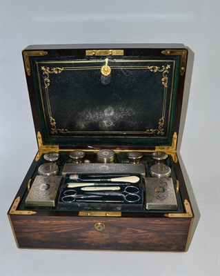 Lot 549 - A Victorian silver gilt mounted travelling dressing table set, Abraham Brownett, London...