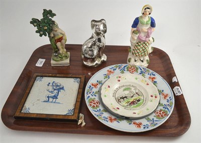 Lot 560 - An early 19th century Staffordshire figure, a Pratt figure, a Nursery plate, a Delft tile, a...