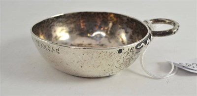 Lot 583 - A silver wine taster inscription to external rim J BERGER DE TANSAC, 11cm (slight basal crumpling)