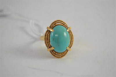 Lot 589 - A turquoise ring, the oval cabochon turquoise in a triple rope twist frame, finger size V