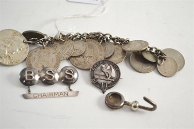 Lot 590 - A small quantity of jewellery, including a coin bracelet, a silver brooch, a silver napkin...