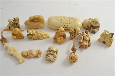 Lot 594 - Fourteen assorted netsukes and carvings including two erotic examples