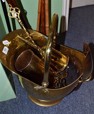 Lot 595 - Brass coal helmet, coal bucket, warming pan, toasting fork, fire iron stand, spit jack etc